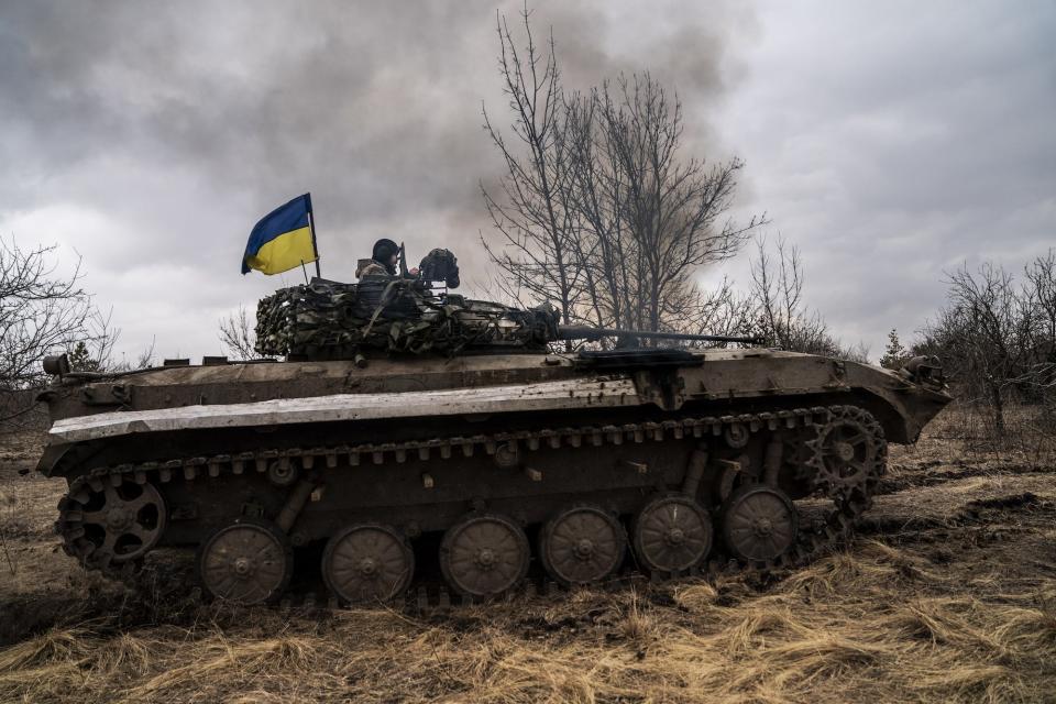 Ukrainian troops on a BWP infantry fighting vehicle prepare for combat towards Lyman in Donetsk Oblast, Ukraine on March 17.