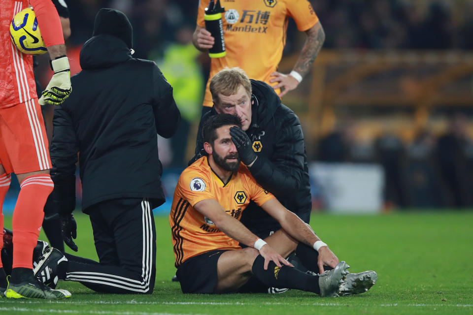 WOLVERHAMPTON, ENGLAND - DECEMBER 04: Joao Moutinho of Wolverhampton Wanderers receives medical treatment during the Premier League match between Wolverhampton Wanderers and West Ham United at Molineux on December 04, 2019 in Wolverhampton, United Kingdom. (Photo by David Rogers/Getty Images)