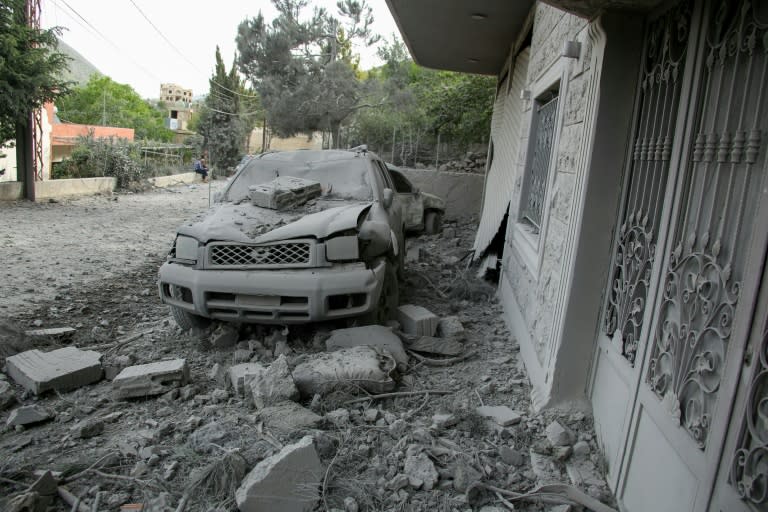 Rubble litters the area around a house hit by an Israeli air strike in the southern Lebanese village of Shebaa (Rabih DAHER)