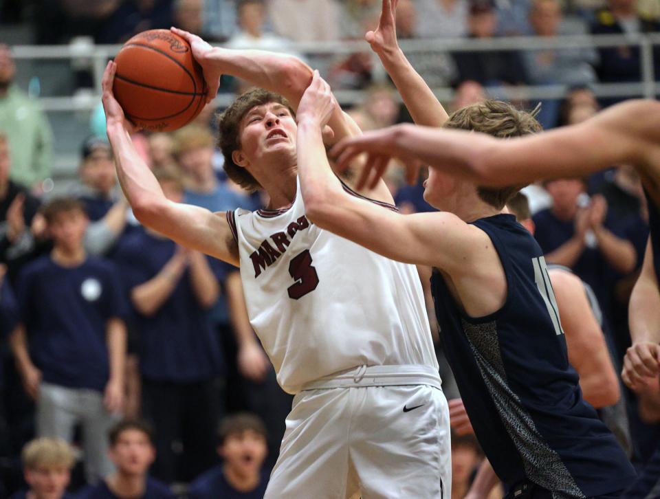 Caleb Karsten looks to shoot as Holland Christian basketball takes on Unity Christian at the Civic Center.