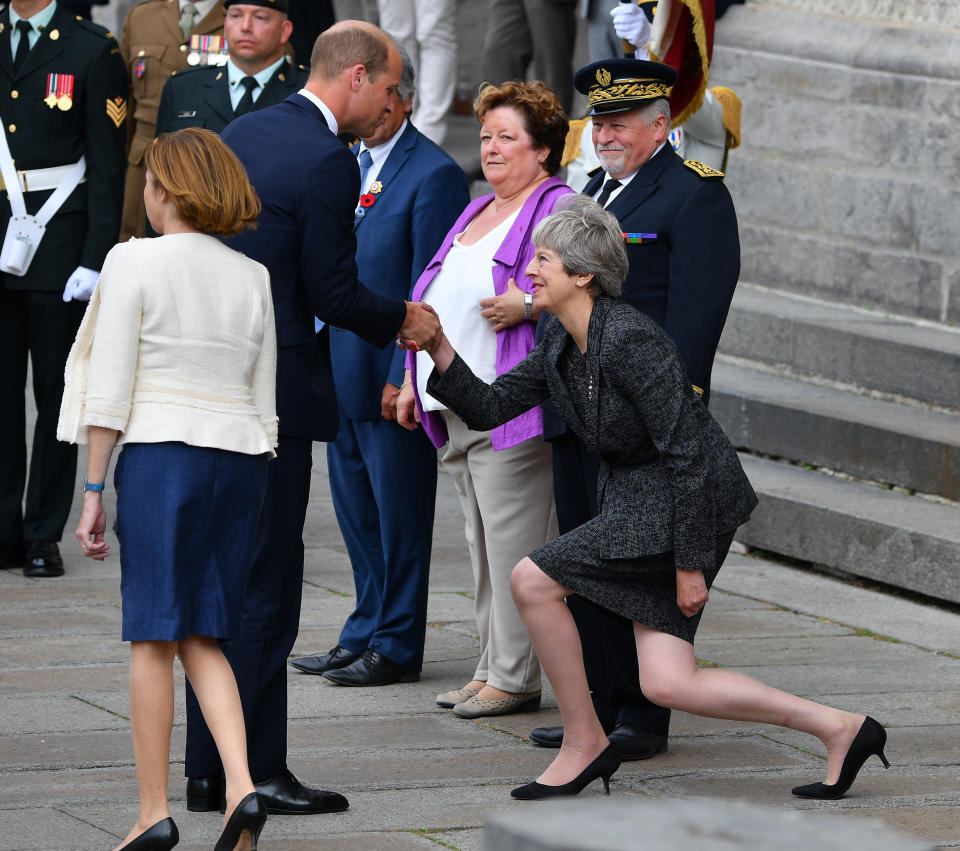 This moment between Prince William and Teresa May happened back in July, but is trending on Twitter now. Photo: AAP