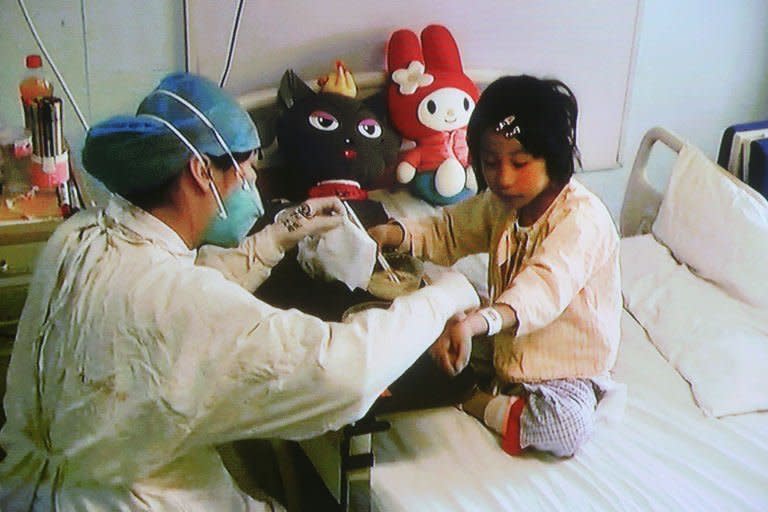 A video grab shows a seven-year-old girl, Beijing's first human case of the H7N9 bird flu, recovering at Ditan hospital in Beijing, April 15, 2013. She left hospital on Wednesday and appeared before media in an apparent bid by health authorities to cool concerns about the deadly virus