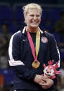 Gold medalist Kayla Harrison, of the United States, smiles in the podium of the women's -78kg of the judo competition at the Pan American Games in Guadalajara, Mexico, Thursday Oct. 27, 2011. (AP Photo/Javier Galeano)