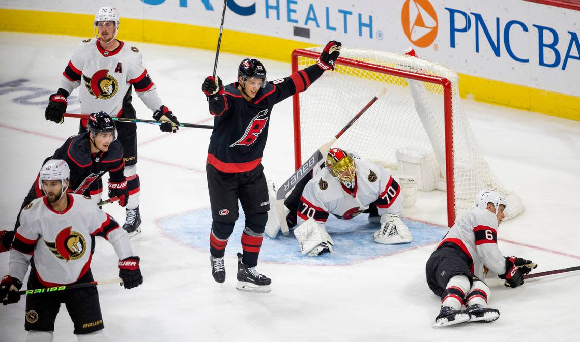 The Carolina Hurricanes Jesperi Kotkaniemi (82) reacts after a goal by teammate Teuvo Teravainen (86) to give the Hurricanes a 2-1 lead in the second period on Wednesday, October 11, 2023 at PNC Arena, in Raleigh N.C. Robert Willett/rwillett@newsobserver.com