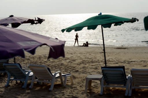 File photo of tourists enjoying the beach on Phuket Island, southern Thailand. Thailand is a tourist magnet but its image as the "Land of Smiles" has been tested in recent years by deadly political unrest, devastating floods and concerns about violent crimes against foreigners