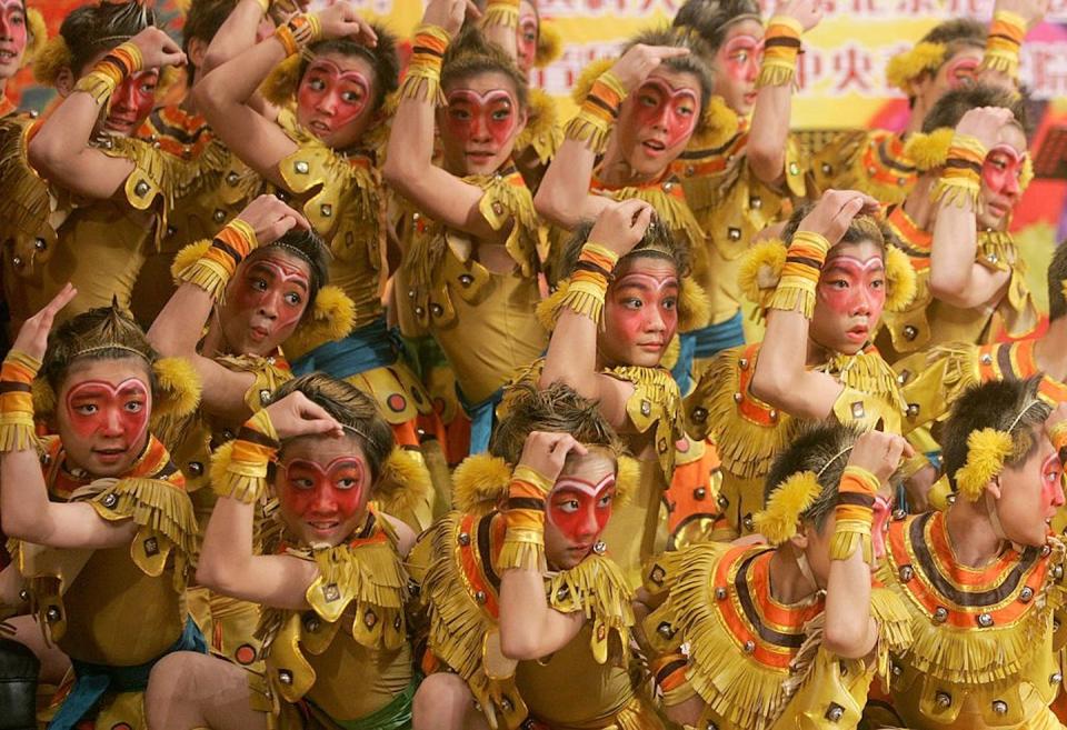 Students of a Beijing opera school dance during a performance about the ‘Monkey King’ in 2006. <a href="https://www.gettyimages.com/detail/news-photo/students-of-an-opera-school-dance-during-a-performance-news-photo/72889325?adppopup=true" rel="nofollow noopener" target="_blank" data-ylk="slk:China Photos/Getty Images;elm:context_link;itc:0;sec:content-canvas" class="link ">China Photos/Getty Images</a>