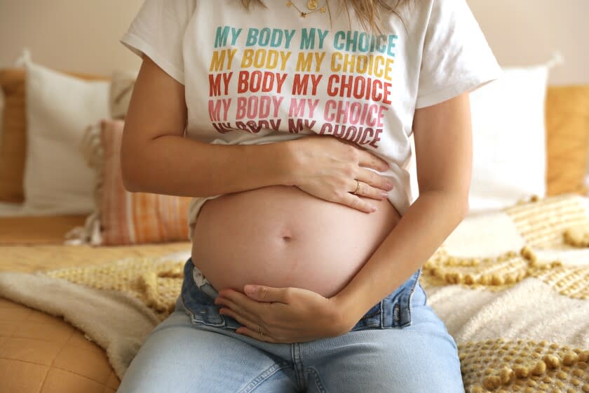 HUNTINGTON BEACH-CA-JULY 19, 2022: Chelsea Maras, 22 weeks pregnant, is photographed at home in Huntington Beach on Tuesday, July 19, 2022. (Christina House / Los Angeles Times)