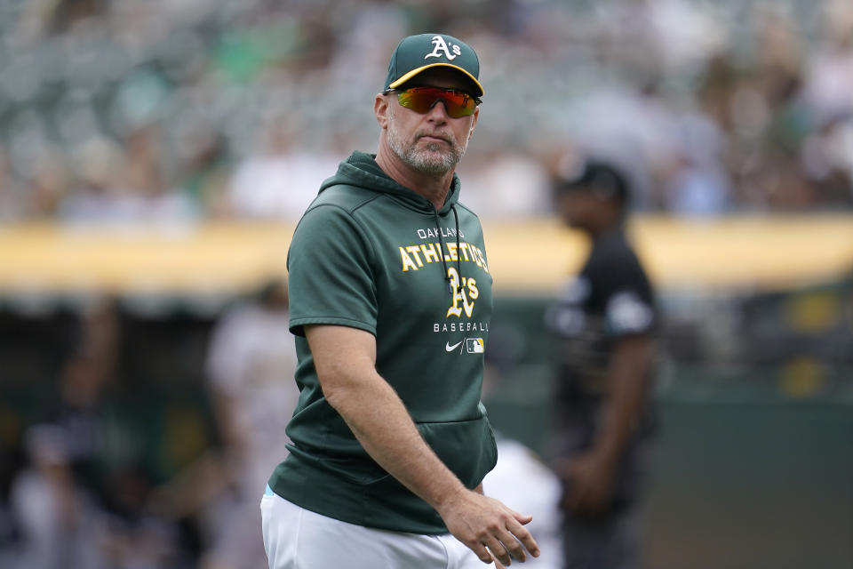 Oakland Athletics manager Mark Kotsay walks to the dugout after making a pitching change during the fourth inning of his team's baseball game against the Chicago White Sox in Oakland, Calif., Saturday, Sept. 10, 2022. (AP Photo/Jeff Chiu)