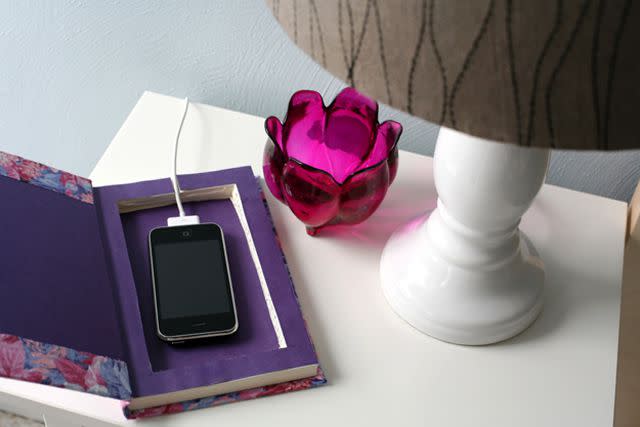 <a href="http://www.caughtonawhim.com/2013/03/diy-book-it-cell-phone-charging-station.html" data-component="link" data-source="inlineLink" data-type="externalLink" data-ordinal="1" rel="nofollow">Caught on a Whim</a>