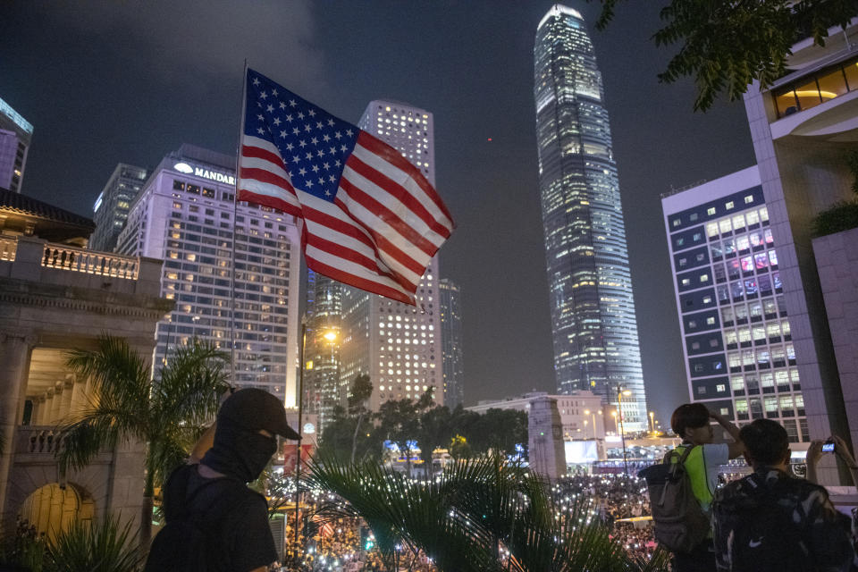 A Protester is seen holding an American Flag during a Rally in Hong Kong, China, October 14, 2019. Protesters gathered in the city's central district in a police-sanctioned rally in support of the Hong Kong Human Rights and Democracy Act, a bill proposed in the U.S. to impose sanctions on the city. (Photo by Vernon Yuen/NurPhoto via Getty Images)