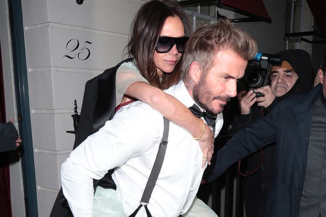 <p>Ricky Vigil M / Justin E Palmer/GC Images</p> David Beckham carries Victoria Beckham out of her birthday party in London on April 20, 2024