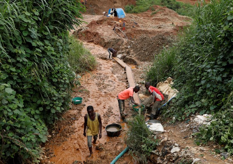 Men work at Makala gold mine camp near the town of Mongbwalu in Ituri province