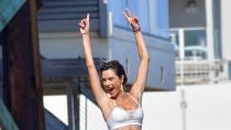 <p>Alessandra Ambrósio has some fun during a photo shoot in Malibu on July 30.</p>