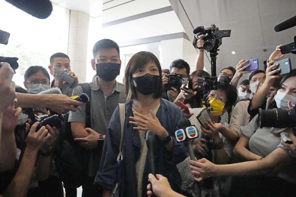 Chan Pui-man, deputy editor of the Apple Daily newspaper walks out from a court in Hong Kong, Saturday, June 19, 2021. A Hong Kong court ordered the top editor of pro-democracy newspaper Apple Daily and the head of its parent company held without bail Saturday in the first hearing since their arrest two days ago under the city's national security law. Chan was one of the five Apple Daily staffs who were arrested by police on Thursday, but she was released on bail Friday. (AP Photo/Kin Cheung)