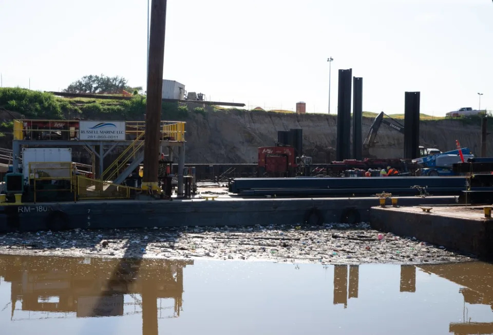 Trash floating around a construction barge at Buffalo Bayou in Houston. Houston Chronicle via Getty Imag