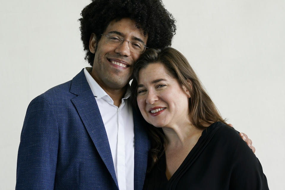 Cellist Alisa Weilerstein, right, and conductor Rafael Payare pose for a portrait at The Rady Shell at Jacobs Park, Wednesday, July 19, 2023, in San Diego. The couple are on a four-concert cross-country run that ends Friday night at Carnegie Hall. (AP Photo/Gregory Bull)