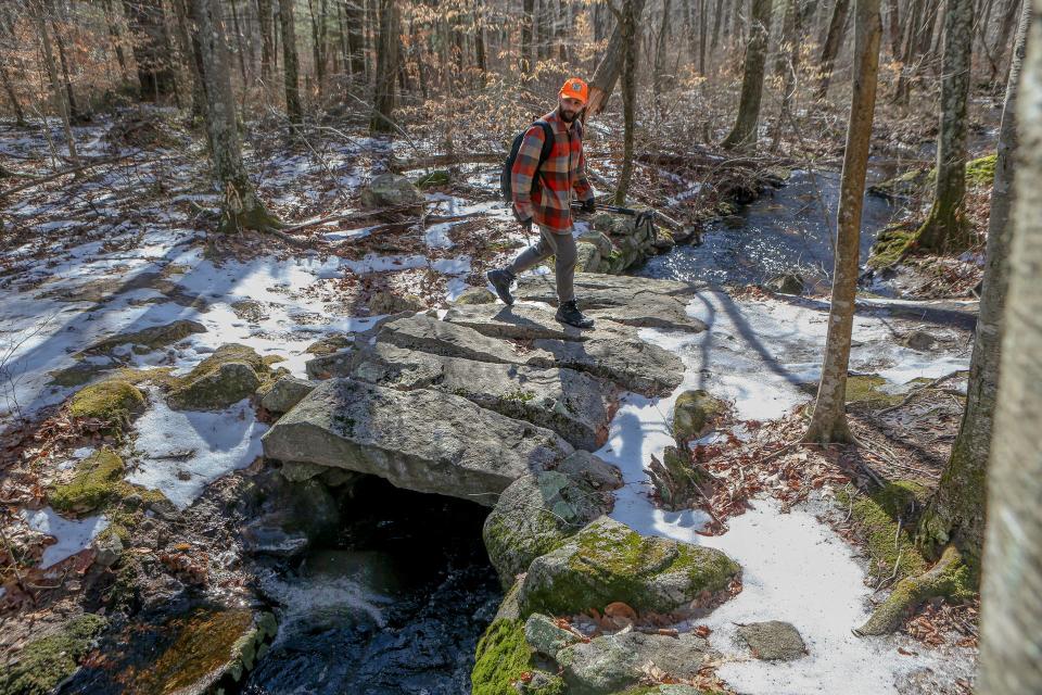 Andrew Grover, shown hiking through Canonchet Preserve in Hopkinton last year, spends a lot of time exploring the woods of Rhode Island. On a hike in Cranston earlier this month, he found what could turn out to be a forgotten historical cemetery that holds the grave of a Revolutionary War soldier.