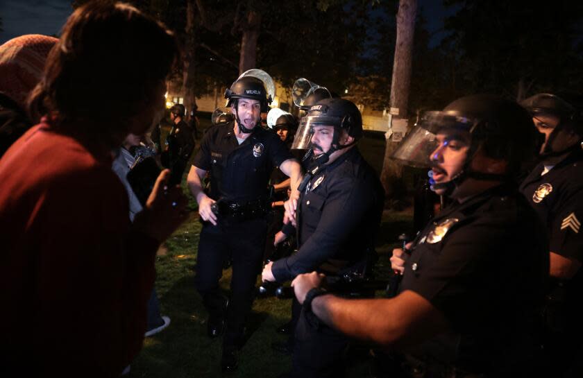 LOS ANGELES, CALIFORNIA - APRIL 24: LAPD officers try to clear the USC campus as a demonstration against the war in in Gaza went into the late Wednesday on the USC campus. (Wally Skalij/Los Angeles Times)