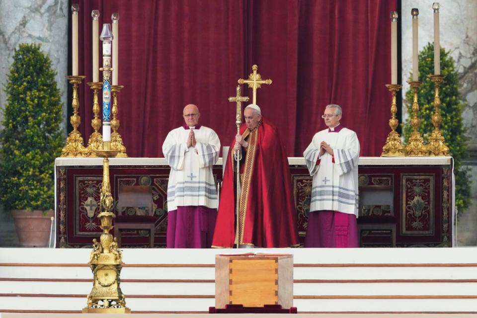 Pope Francis, centre, stands by the coffin of late Pope Emeritus Benedict XVI St. Peter’s Square during a funeral mass at the Vatican (AP)