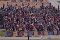 Fans social distance as they watch a stage show before the NFL Super Bowl 55 football game between the Kansas City Chiefs and Tampa Bay Buccaneers, Sunday, Feb. 7, 2021, in Tampa, Fla. (AP Photo/Charlie Riedel)