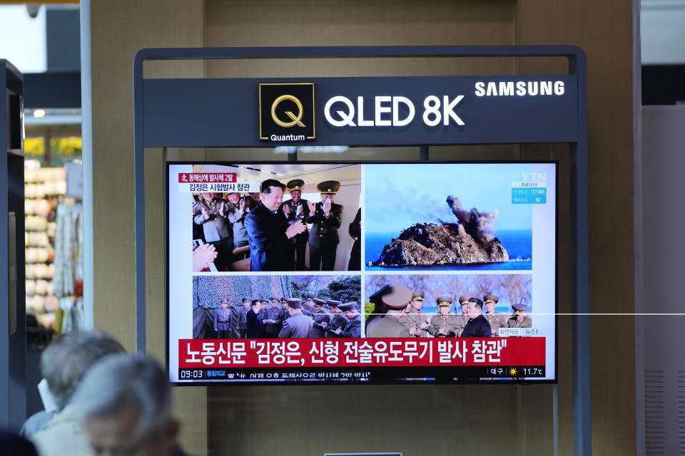 People watch a TV screen show a news program reporting North Korean leader Kim Jong Un was observing a test-firing of a newly developed tactical guided weapon, at a train station in Seoul, South Korea, Sunday, April 17, 2022. North Korea said Sunday it has successfully test-fired a newly developed tactical guided weapon, the latest in a spate of launches that came just after the country passed its biggest state anniversary without an expected military parade, which it typically uses to unveil provocative weapons systems. (AP Photo/Lee Jin-man)