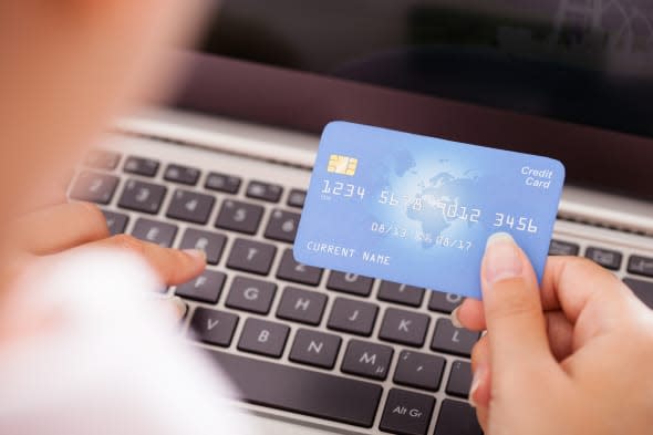 Close-up Of Female Hand With Credit Card Shopping Online