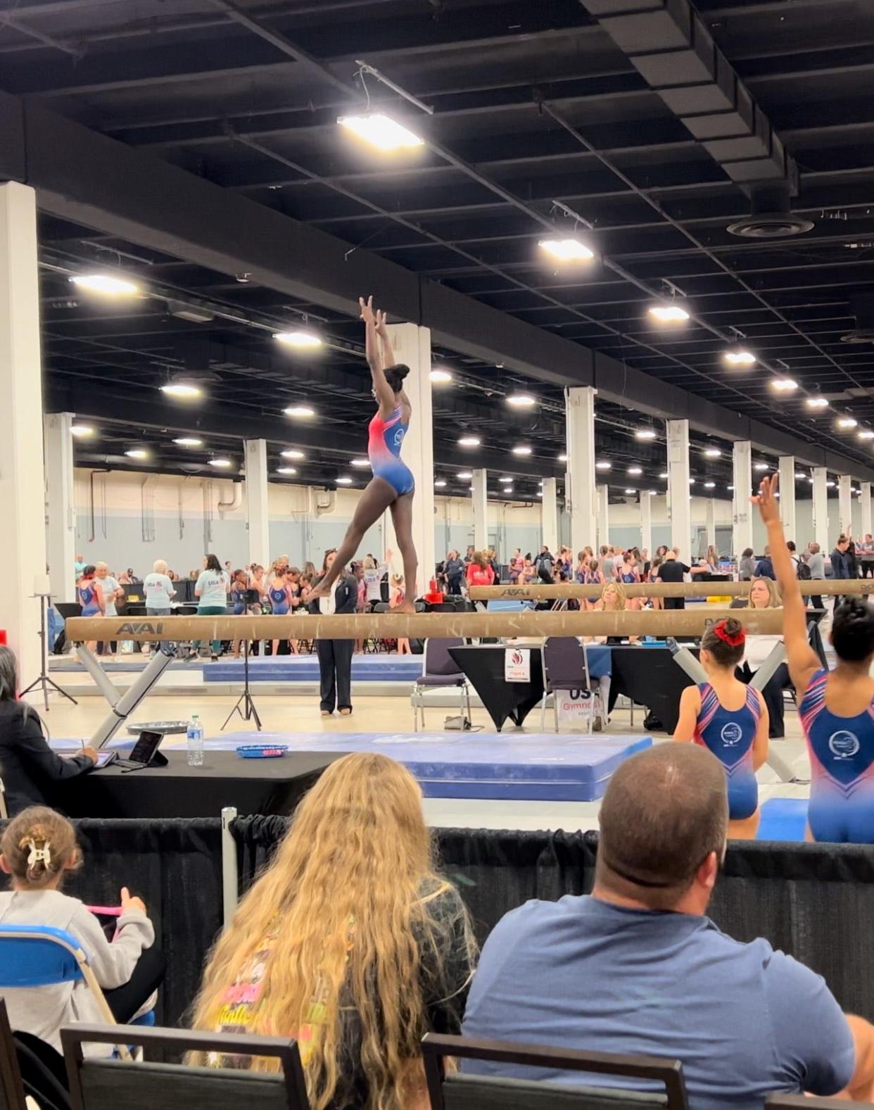 Brianna Pittman, 12, of Gray, performing on the balance beam at the 2024 USA Gymnastics Region 8 Xcel Regional Championships in South Carolina, May 3.