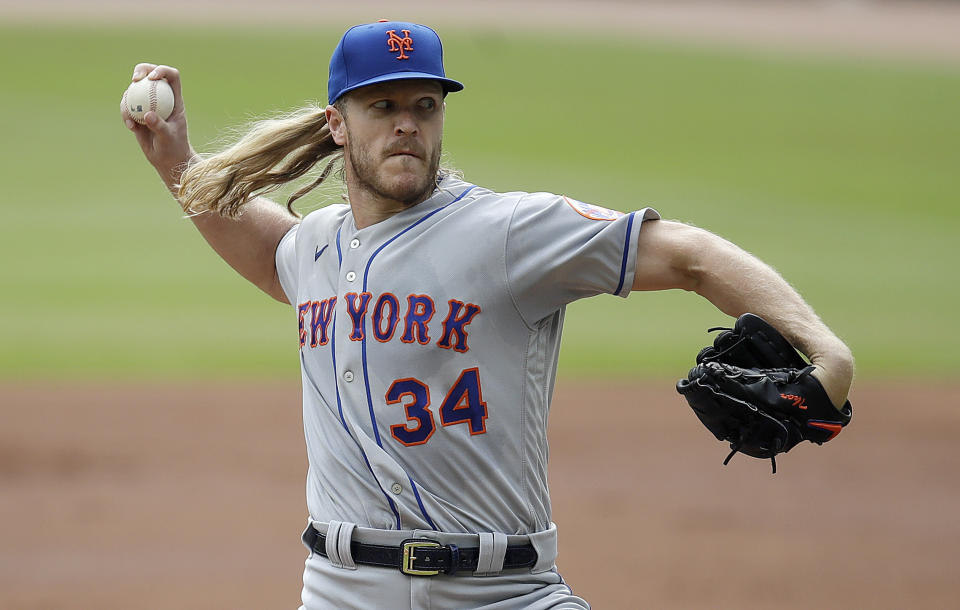 New York Mets pitcher Noah Syndergaard works against the Atlanta Braves in the first inning of a baseball game Sunday, Oct. 3, 2021, in Atlanta. (AP Photo/Ben Margot)