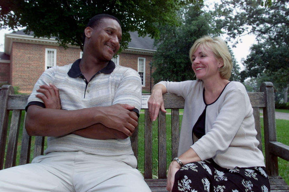 Jennifer Thompson-Cannino, right, with Ronald Cotton in Greensboro, N.C., Sept. 14, 2000. Thompson identified Cotton as the man who raped her in 1984. After serving almost 11 years of a life sentence, Cotton was released from prison when DNA testing revealed another man raped Thompson-Cannino. They have become friends since Cotton's release. (AP Photo/Chuck Burton)