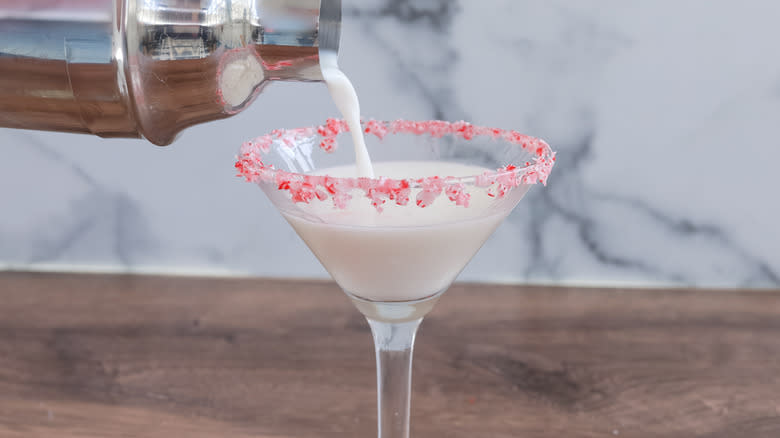 pouring cocktail into glass