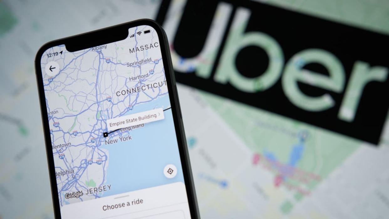 <div>The Uber app application with a map of New York City is seen on an Apple iPhone mobile phone in this photo illustration Warsaw, Poland on 21 September, 2022. (Photo by STR/NurPhoto via Getty Images)</div>