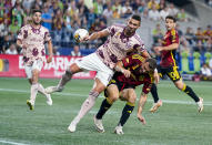 Portland Timbers defender Dario Zuparic, left, keeps Seattle Sounders forward Jordan Morris from a shot on goal during the second half of an MLS soccer match Saturday, Sept. 2, 2023, in Seattle. The teams played to a 2-2 draw. (AP Photo/Lindsey Wasson)