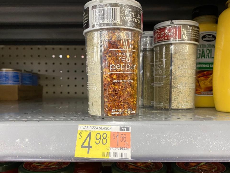 container of pizza seasoning on the shelves at walmart