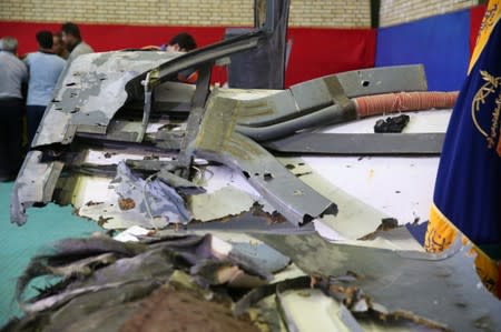 The purported wreckage of the American drone is seen displayed by the Islamic Revolution Guards Corps (IRGC) in Tehran