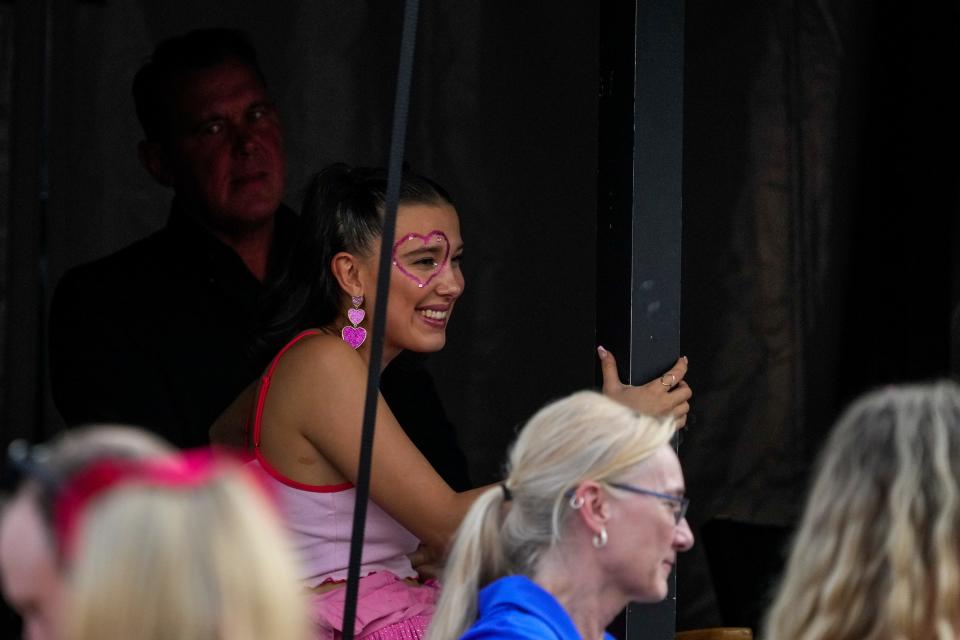 Actor Millie Bobby Brown watches from a VIP tent before Taylor Swift performs Friday night at Paycor Stadium.