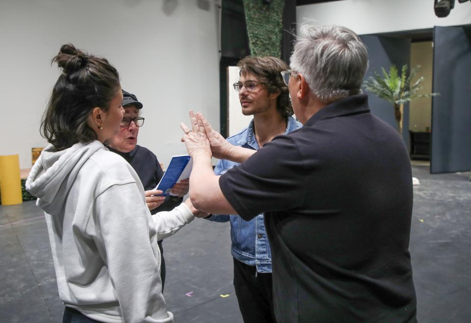 Shelby Victoria, white sweatshirt, and Christian Fonte, in blue, rehearse for the Desert Theatricals production of "South Pacific" at the Rancho Mirage Amphitheater, Feb. 6, 2023.  At right is choreographer Ray Limon and second from left is stage manager Lee Stone