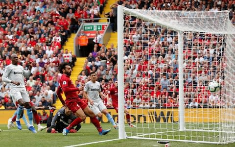  Liverpool's Mohamed Salah scores their first goal - Credit: REUTERS