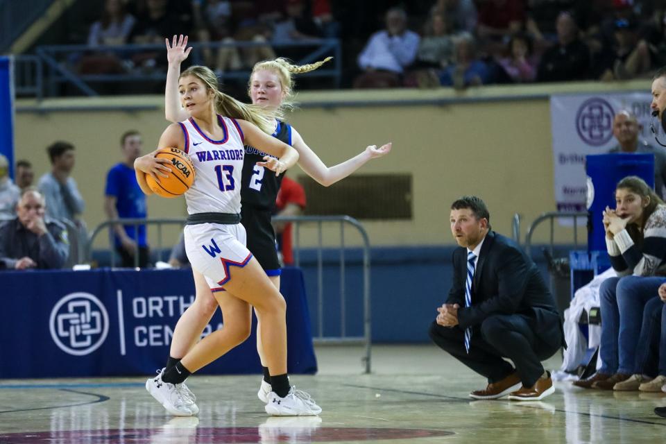 Hammon’s Maylee Chaney (13) looks to pass as Lomega’s Abby Swart (2) defends during the Class B girls championship game between the Hammon Lady Warriors and the Lomega Lady Raiders at the Jim Norick Arena in Oklahoma City on Saturday, March 4, 2023. 