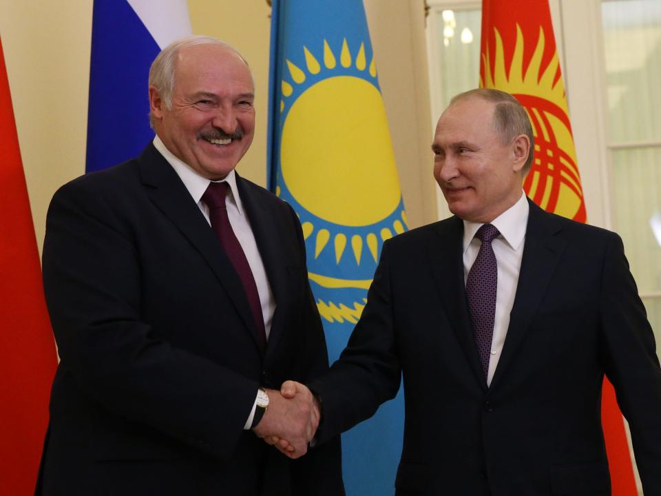 Russian President Vladimir Putin (R) greets Belarussian President Alexander Lukashenko (L) during the welcoming ceremony in Saint Petersburg, Russia, December 20, 2019.