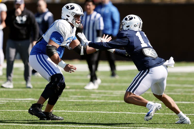 BYU offensive lineman Kingsley Suamataia blocks defensive end Isaiah Bagnah as the Cougars practice in Provo.