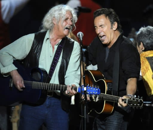 Bruce Springsteen (R) and Arlo Guthrie, who both drew inspiration from the storied career of the latter's father, perform during a concert for folk music legend Pete Seeger's 90th birthday in 2009