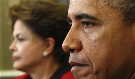 U.S. President Barack Obama meets with Brazil President Dilma Rousseff in the Oval Office of the White House in Washington April 9, 2012. REUTERS/Kevin Lamarque