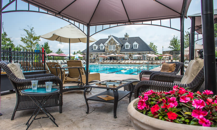 Amenities include an expansive heated pool. Trump National Golf Club