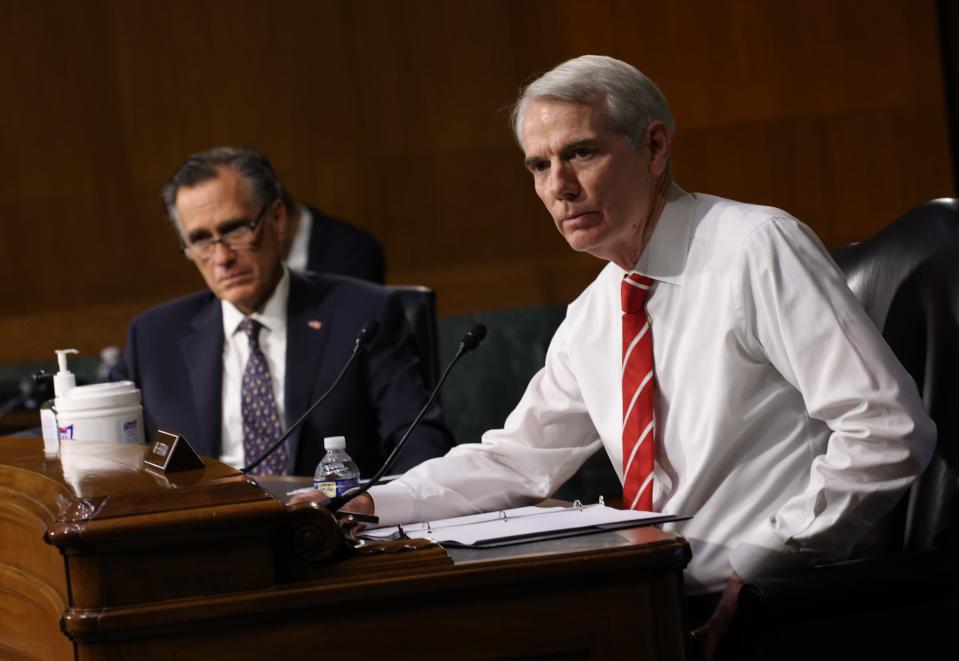 Sen. Mitt Romney, R-Utah, and Sen. Rob Portman, R-Ohio, attend a Senate Foreign Relations Committee hearing on U.S. policy towards Belarus at the Dirksen Senate Office Building on Wednesday in Washington.