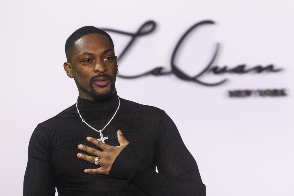 Designer LaQuan Smith greets attendees at the end of his show collection during Fashion Week, Saturday, Feb. 8, 2020, in New York. (AP Photo/Eduardo Munoz Alvarez)