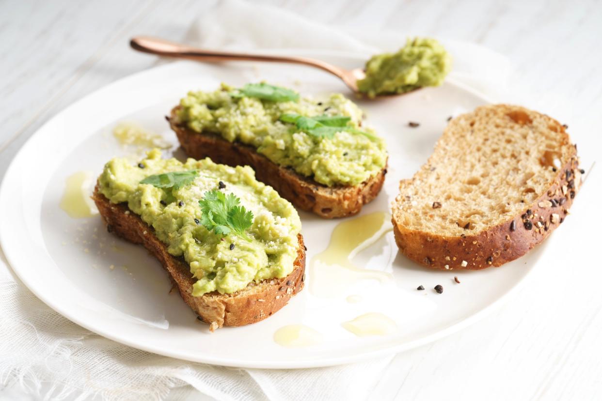 Healthy breakfast toast with avocado smash