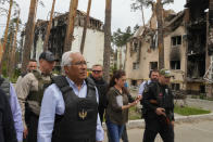 Portuguese Prime Minister Antonio Costa, center left, walks surrounded by media and security in Irpin, Ukraine, Saturday, May 21, 2022. (AP Photo/Efrem Lukatsky)