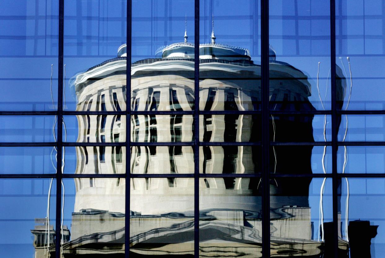 Reflection of the Ohio Statehouse in the windows of the Huntington Center in downtown Columbus.