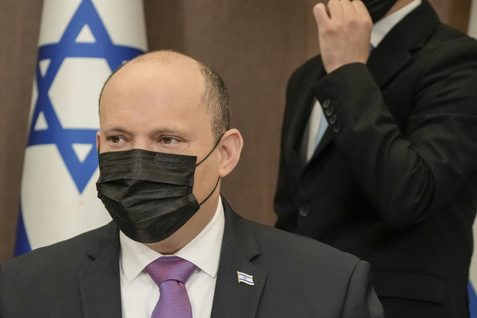 Israeli Prime Minister Naftali Bennett achairs the weekly cabinet meeting in Jerusalem, Sunday, Feb. 20, 2022. (AP Photo/Tsafrir Abayov, Pool)