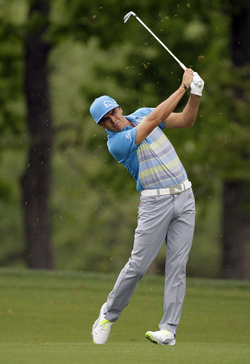 Rickie Fowler hits from the fairway to the 16th green during the pro-am of the Wells Fargo Championship golf tournament at Quail Hollow Club in Charlotte, N.C., Wednesday, April 30, 2014. (AP Photo/Bob Leverone)